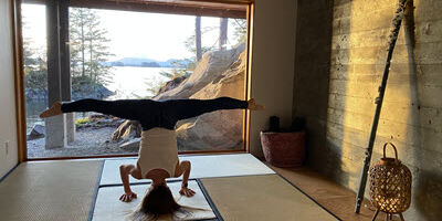 woman doing handstand yoga pose